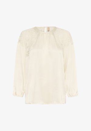Krém színű hosszú ujjú blúz csipkés vállrészletekkel, ráncolt nyakkivágással, gumis ujjvégekkel és hátul gombos záródással.