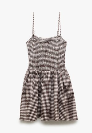 Ruskea ja valkoinen ruudullinen mekko, joka on valmistettu smock-kankaasta. Mekossa on ohuet hihnat, istuva yläosa ja laaja hame.