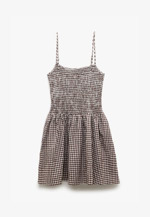 Ruskea ja valkoinen ruudullinen mekko, joka on valmistettu smock-kankaasta. Mekossa on ohuet hihnat, istuva yläosa ja laaja hame.