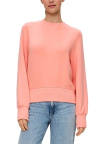 Koraalroze sweatshirt met een ronde hals, lange mouwen, ribbelmanchetten en een ribbelzoom. Zachte stof met een gladde textuur. Gecombineerd met lichtgewassen denim.