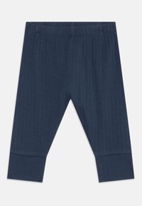 Marina ribbade leggings med resårmidja och åtsittande muddar, med vertikala ränder och en mjuk textur.