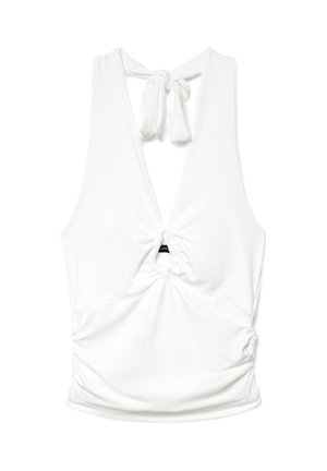 Haut dos-nu blanc sans manches avec un décolleté plongeant en V, fermeture à nouer dans le dos et des détails froncés à l'avant et sur les côtés.