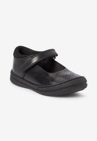 Schwarze Leder-Mary-Jane-Schuhe mit einem Riemen und perforiertem Design an den Zehen. Sie verfügen über eine strukturierte Gummi-Außensohle für Halt und Flexibilität.