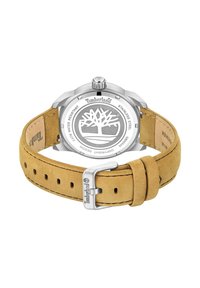 Zegarek Timberland z stalową kopertą, brązowym zamszowym paskiem i srebrnym logo na odwrocie. Wodoodporny do 5 ATM.