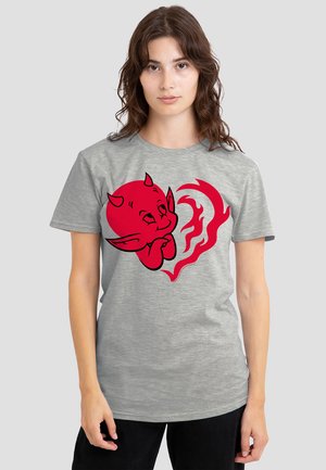 Gray t-shirt featuring a red cartoon devil character with large eyes and a heart shape, surrounded by flame-like accents. Short sleeves, casual fit.