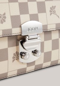 Beige and gray checkered bag with a textured leather finish, featuring a silver clasp with the brand "JOOP!" prominently displayed.