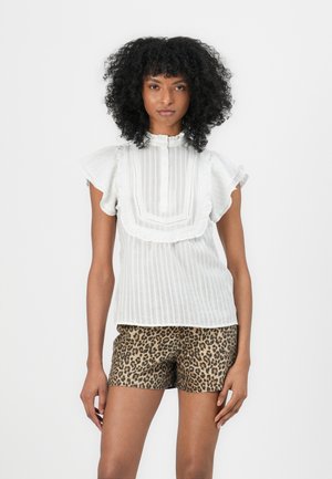 White striped blouse with a ruffled collar and short sleeves, paired with leopard-print shorts. Blouse features button closure and delicate lace trim.