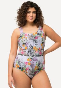 Maillot de bain une pièce avec un imprimé floral et graphique multicolore, des bretelles violet clair et une coupe ajustée avec un col haut.