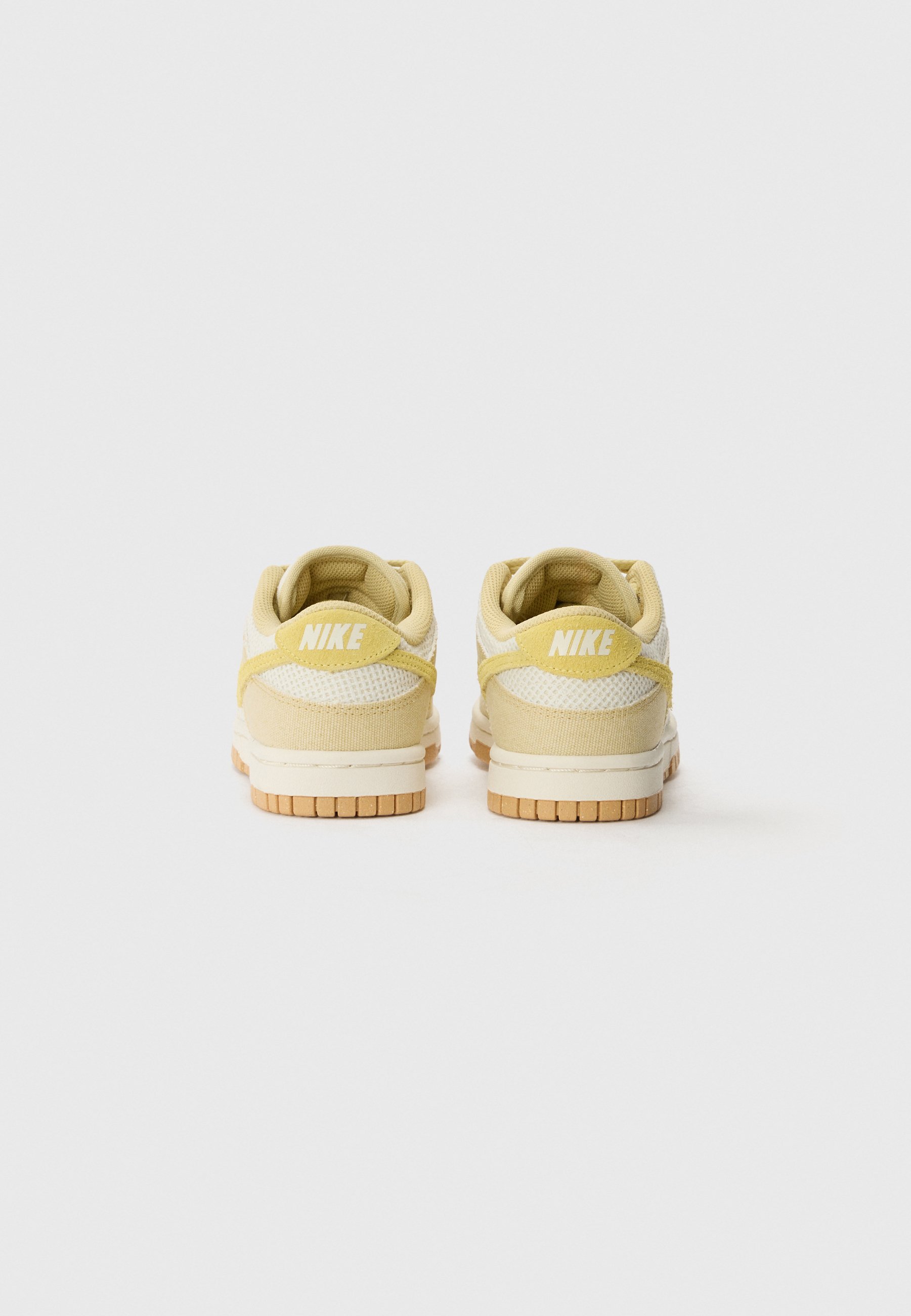 pastel yellow nike