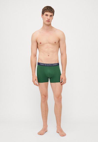 Groene boxershorts met een marineblauwe tailleband met het logo "POLO RALPH LAUREN". De stof is glad met een getailleerd ontwerp.