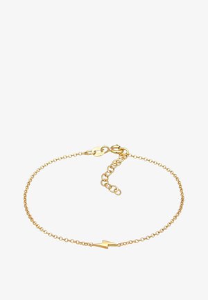 Gul kædearmbånd med et delikat linkdesign og en vinkelret lynbolt charm. Låsning med justerbar kædeforlængelse.