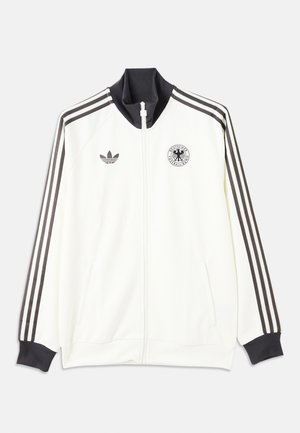 Witte Adidas jas met rits, zwarte kraag, drie zwarte strepen langs de mouwen en het logo van de Deutscher Fußball-Bund op de borst.
