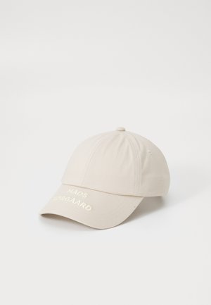 Beige baseball cap made of cotton, featuring a curved brim and embroidered logo in light yellow on the front. Smooth texture, casual design.