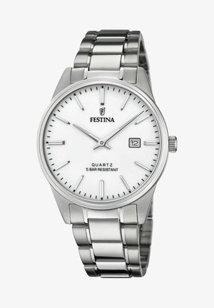 Montre en acier inoxydable argenté avec un cadran blanc, des index horaires et une fenêtre de date à 3 heures. Design de bracelet avec maillons polis.
