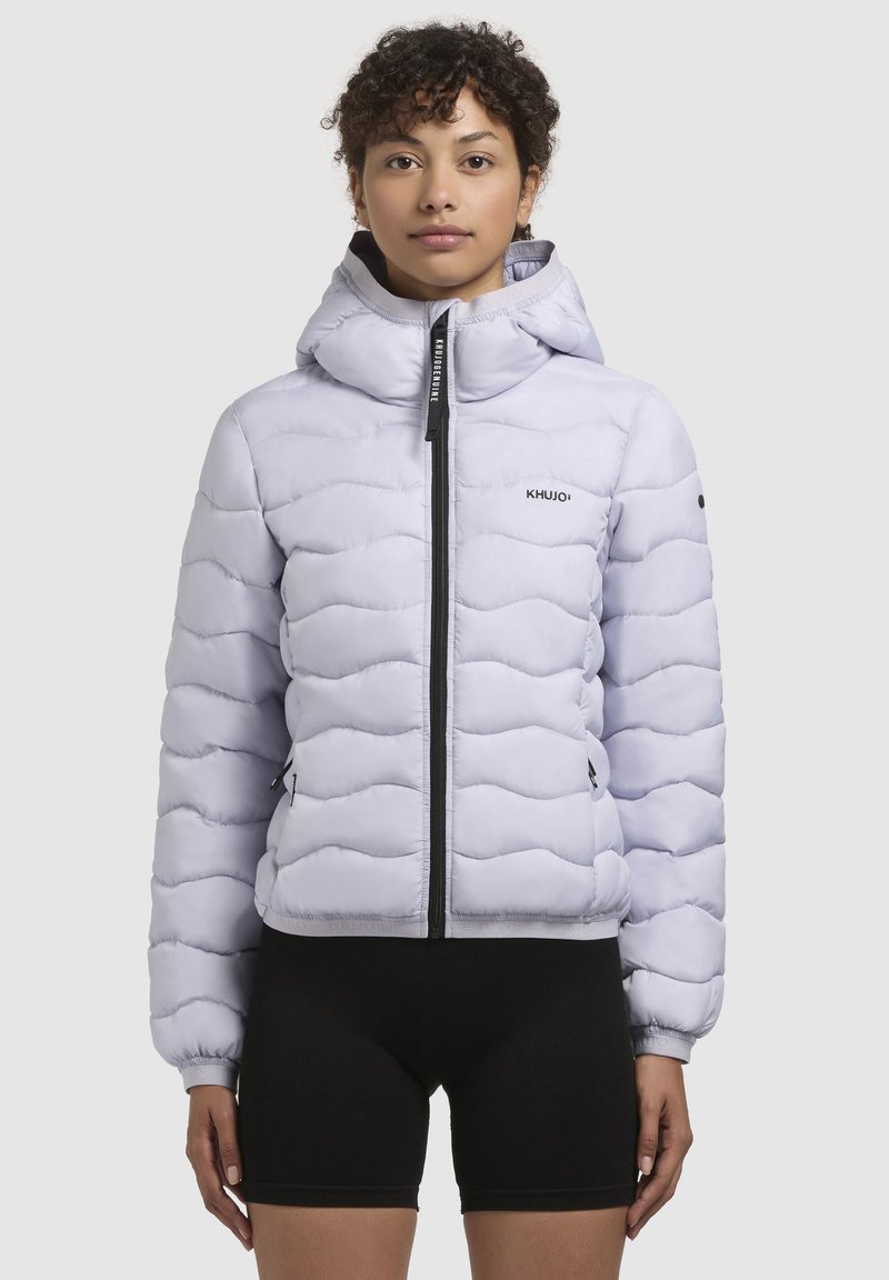 Light purple puffer jacket with a fitted design, high collar, and zip closure. Features wavy pattern and KHUJO logo on the chest.