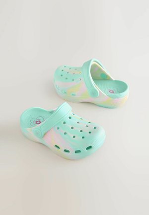 Light turquoise clogs made of flexible material, featuring a back strap, ventilation holes, and a smooth finish with a subtle pastel design.