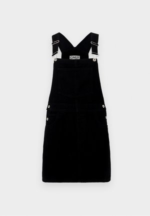 Juodų džinsinių kombinezonų suknelė su reguliuojamomis petnešomis, sidabro tono detalėmis, priekinėmis kišenėmis ir galine kišene. Lygi tekstūra ir prigludęs dizainas.