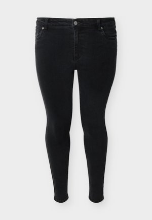 Μαύρο στενό τζιν με κουμπί μπροστά, κλείσιμο με φερμουάρ και στιλ με πέντε τσέπες, εμφανίζεται σε απλό φόντο.