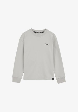 Sweat-shirt gris clair en tissu mélangé coton. Dispose d'un col rond, de manches longues, et d'un petit logo noir "SALTY DOG" sur la poitrine.