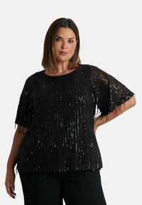 Svart paljett-topp med korta ärmar, med fransdetaljer. Tyget är texturerat och designen har en lös passform och rund halsringning.