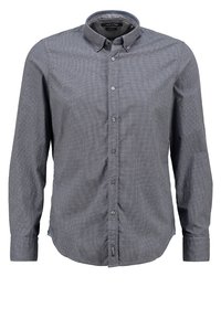 Tummanharmaasta kankaasta valmistettu nappipaita, jossa on pieni ruutukuosi. Siinä on kaulus, pitkät hihat ja helman kohdalla oleva lappu.