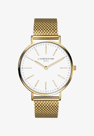 Gold Mesh-Uhrenarmband mit einem weißen Zifferblatt, goldenen Stundenmarkierungen und vier kleinen Kristallen. Hat ein minimalistisches Design und ein rundes Metallgehäuse.