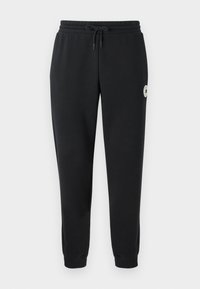 Pantaloni de trening negri din bumbac cu talie elastică, șnur și mansete cu tricotare; prezintă un logo circular pe coapsa stângă.