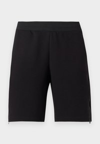 Černé sportovní šortky vyrobené z měkké látky, s těsným elastickým pasem a zipy po stranách pro zvýšení funkčnosti.