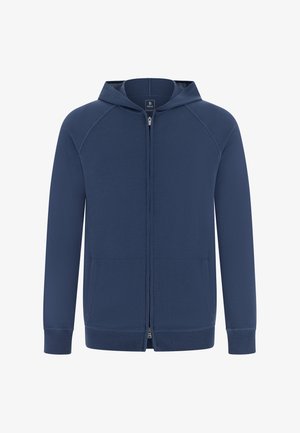 Granatowa bluza z kapturem zapinana na zamek, z długimi rękawami raglanowymi, dwoma przednimi kieszeniami, ściągaczami na rękawach i dole. Wykonana z miękkiej, teksturowanej tkaniny.