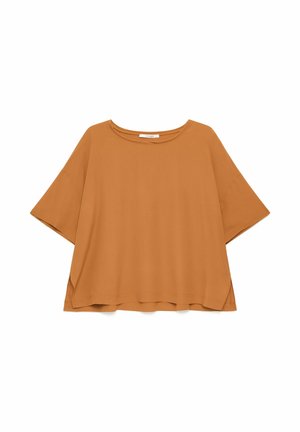 Top a maniche corte dalla vestibilità ampia in arancione bruciato con scollo rotondo e orlo posteriore leggermente più lungo.