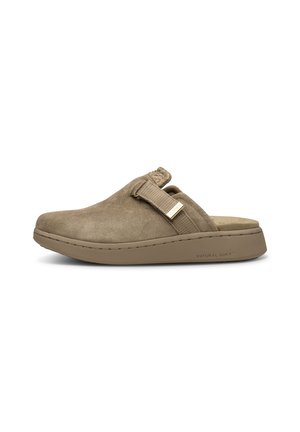 Beige suede clog with a stretch fabric strap, rounded toe, and textured accent. Features a low, cushioned sole for comfort.