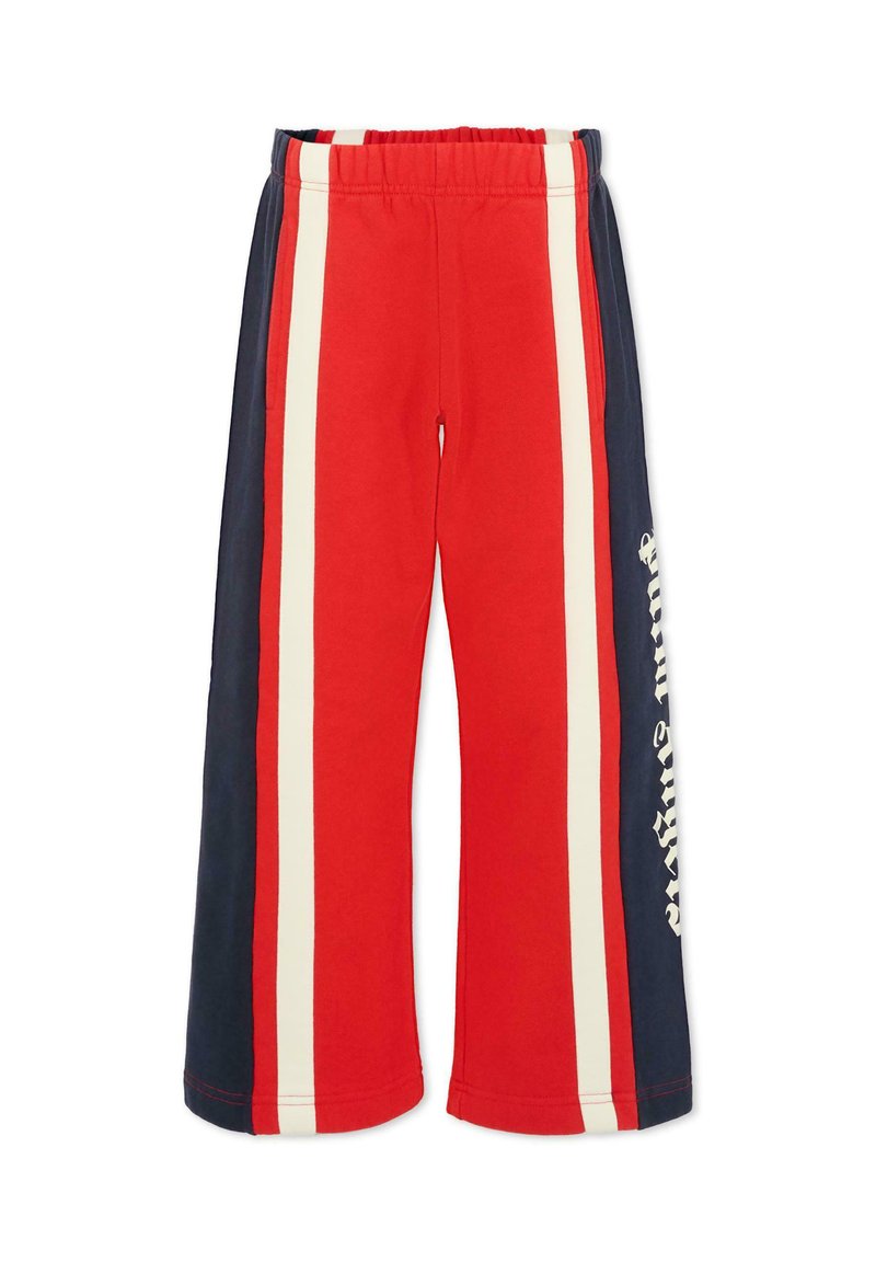 Rode joggingbroek met verticale strepen in marineblauw en crème. Bevat een elastische tailleband en zijzakken. Inclusief tekstdetails aan één zijde.