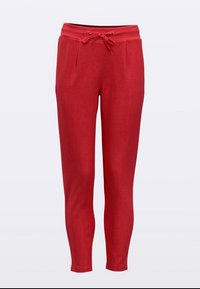 Czerwone spodnie dresowe wykonane z miękkiego materiału, z regulowanym sznurkiem w pasie, dwoma przednimi kieszeniami i zwężanym krojem nogawek. Gładka tekstura.