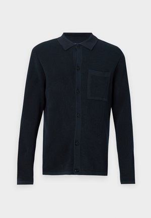 Navy blue cardigan with a textured knit fabric, button closure, and a chest pocket. Features a collared neckline and long sleeves.