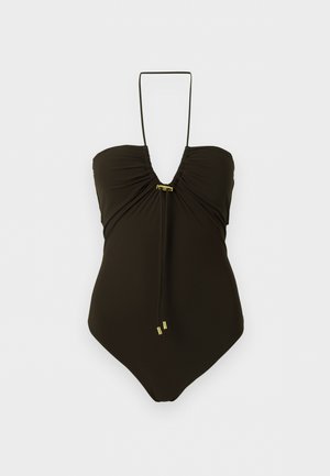 Schwarzer Einteiler mit Neckholder, gerafftem Brustbereich und kleinen goldfarbenen Metallakzenten in der Mitte und an den Enden der Bänder.