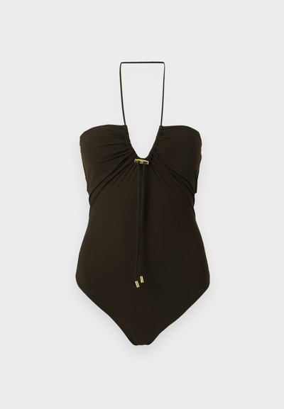 Μαύρο ολόσωμο μαγιό με δέσιμο στον λαιμό, συγκεντρωμένη λεπτομέρεια στο στήθος και μικρές μεταλλικές χρυσές πινελιές στο κέντρο και στα άκρα των δεσίμάτων.