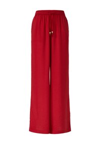 Pantalons larges rouges en tissu texturé. Équipés d'une taille élastique avec un cordon de serrage et des perles décoratives.