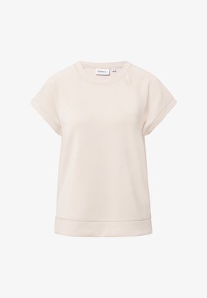 Haut beige clair à manches courtes avec un col rond et une coupe décontractée. Tissu doux avec des détails de couture visibles et un ourlet légèrement incurvé.