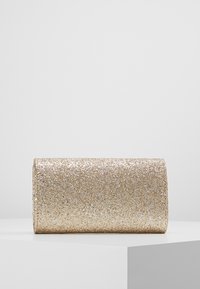 Glittering gold clutch bag with a rectangular shape, smooth texture, and metallic finish. Front covered in small metallic flecks.