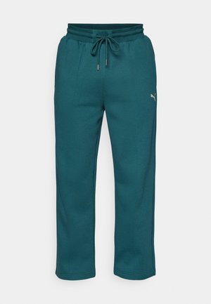 Teal sweatpants van een zachte, gestructureerde stof. Voorzien van een elastische tailleband met een trekkoord en zijzakken. Logo-accent op het been.
