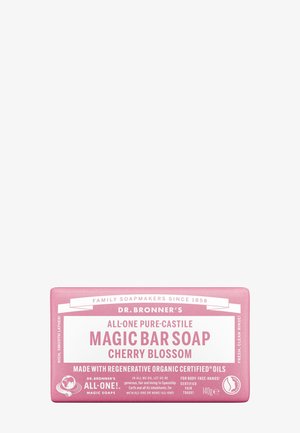 Dr. Bronner's pink Cherry Blossom Magic Bar soap with label highlighting organic oils, fair trade, and multi-use for body, face, and hands.