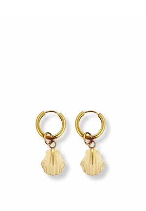 Gold hoop earrings with small gold scallop shell charms hanging from each hoop on a white background.