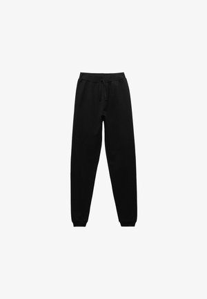 Pantalones de chándal negros hechos de una mezcla de algodón. Cuentan con una cintura elástica con cordón, puños acanalados en los tobillos y una textura suave.
