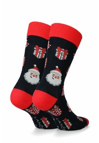 Czarne skarpetki z czerwonymi akcentami mają wizerunki twarzy Świętego Mikołaja oraz pudełek z prezentami w białym i czerwonym kolorze, wykonane z miękkiego materiału dla komfortu.