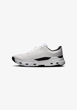 White athletic sneaker with a mesh upper, black accents, and a cushioned sole. Features a rounded toe and lace-up design.