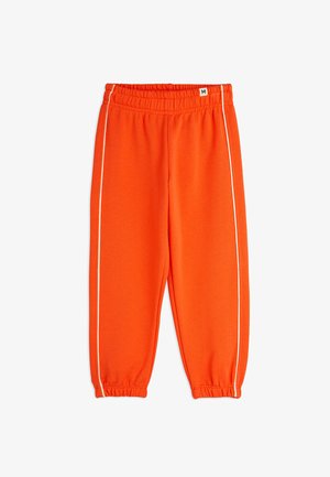 Gaiši oranžas jogger bikses ar elastīgu jostasvietu un apkaklēm, ar baltām sānu svītrām kontrastam. Izgatavotas no mīksta, elastīga auduma.