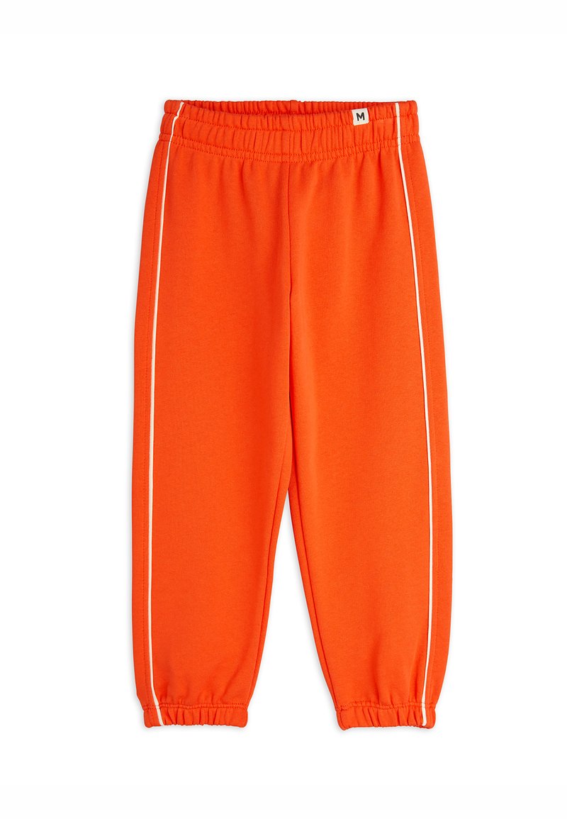 Lys orange joggebukser med elastisk midjebånd og mansjetter, med hvite sidestriper for kontrast. Laget av myk, elastisk stoff.