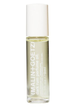 Roll-on-Parfümöl in einer klaren Glasflasche mit einem weißen Deckel. Das Etikett zeigt fett gedruckten weißen Text auf einem transparenten Hintergrund.