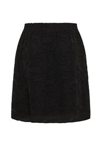 Jupe noire longueur genou avec taille élastique et motif floral en relief sur tissu léger.