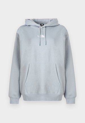 Helehall hall kapuutsiga pusa esitasku, nöörist reguleeritav ja valge rinnalogo. Pehme, sile kangas, soonikud mansettidel.